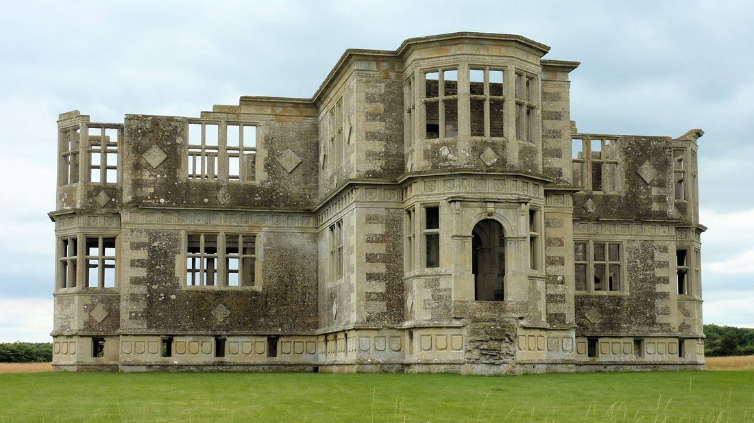 Lyveden New Bield: the unfinished Elizabethan cruciform lodge built for Sir Thomas Tresham, abandoned in 1605 — diamond-panelled ashlar walls, polygonal bay windows, and roofless upper storey with empty mullioned window frames
